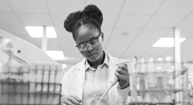 SINGLE-IMAGE_young-female-scientist-filling-chemical-through-pipette_mar25