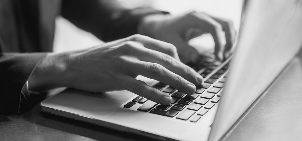 SINGLE-IMAGE_close-up-of-a-hands-of-a-businessman-on-a-keyboard_jul25