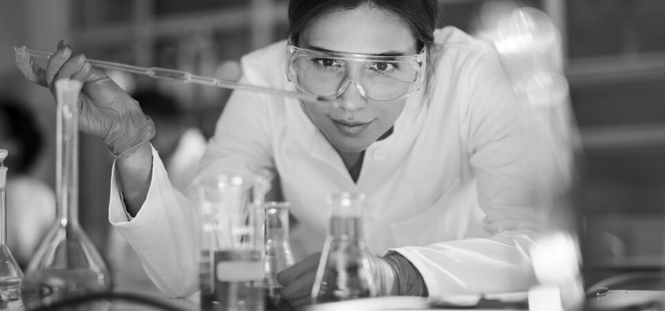SINGLE-IMAGE_female-scientist-examining-liquid-in-laboratory_mar25
