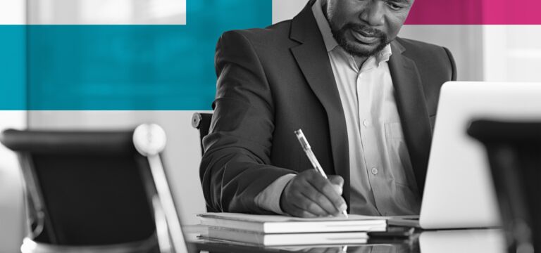 SINGLE-IMAGE_squares-man-with-pen-and-books-at-desk_feb24