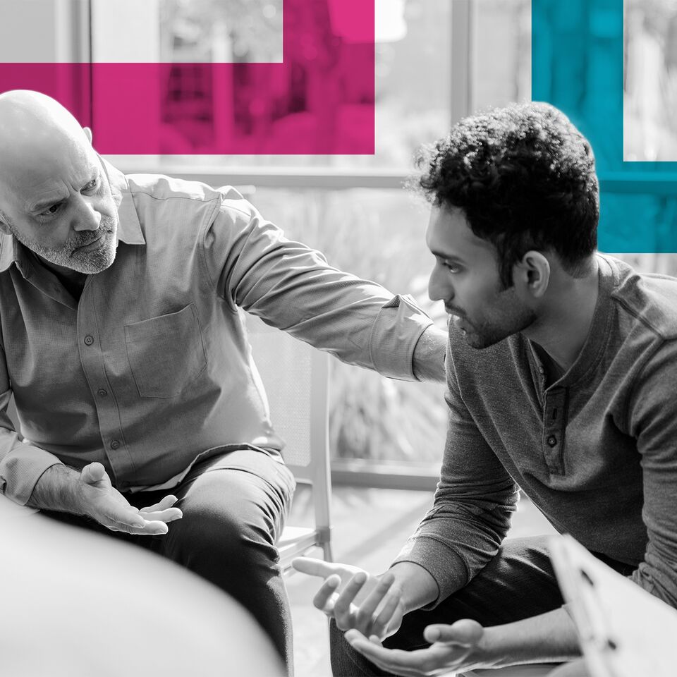 SINGLE-IMAGE_man-being-consoled-by-older-man-with-squares_apr24