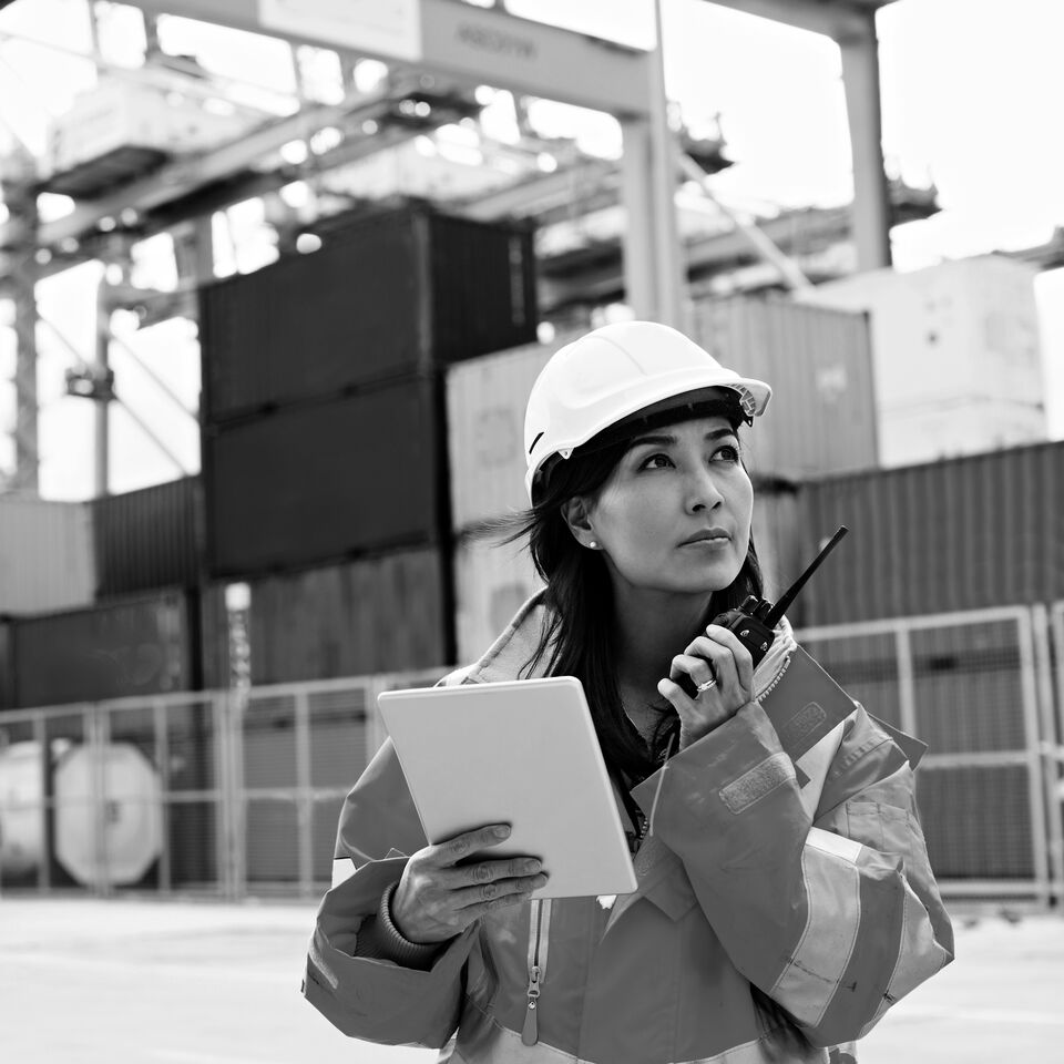 SINGLE-IMAGE_lady-with-walkie-talkie-on-ship-deck-black-and-white_jul24