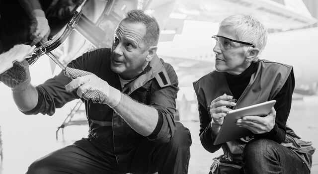 SINGLE-IMAGE_aircraft-engineers-with-digital-tablet_feb25