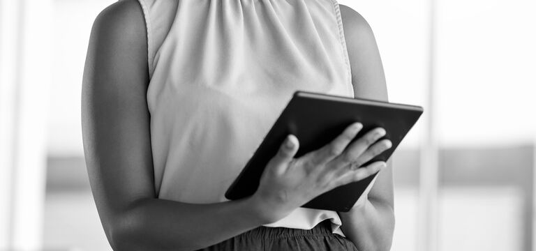 SINGLE-IMAGE_black-woman-smiling-with-tablet_aug24