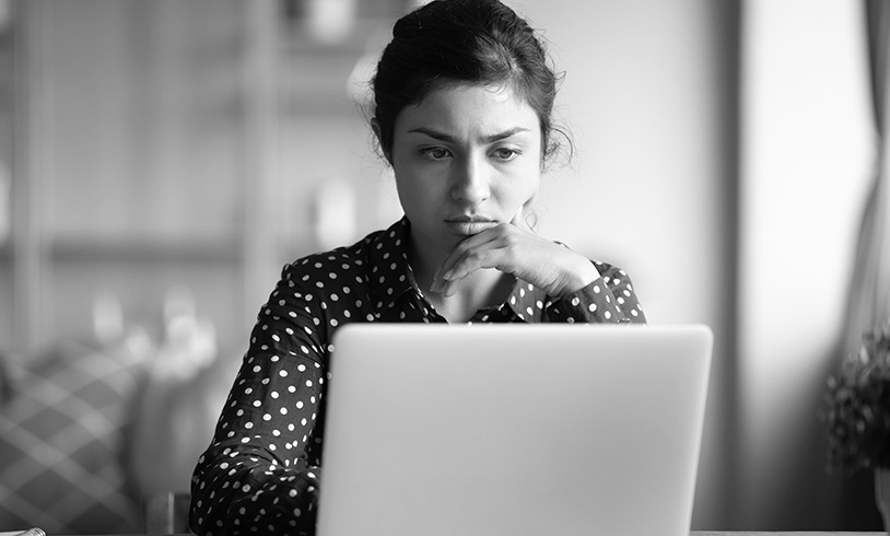 SINGLE-IMAGE_serious-frowning-indian-woman-read-email-on-laptop_jul25