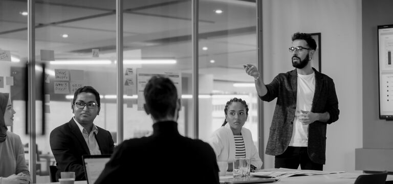 SINGLE-IMAGE_office-workers-in-meeting-no-squares_mar24