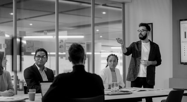 SINGLE-IMAGE_office-workers-in-meeting-no-squares_mar24