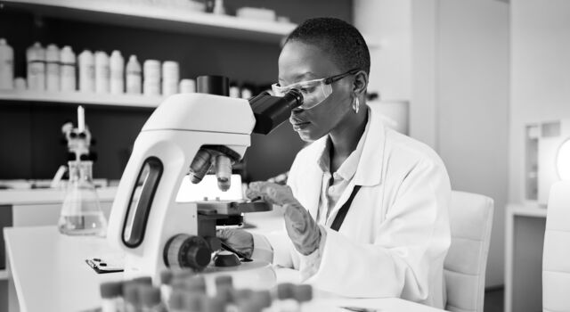 SINGLE-IMAGE_science-laboratory-and-woman-on-microscope-for-blood-test-research_mar25